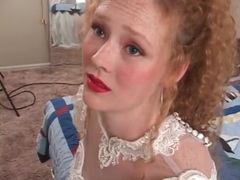 KiloGirls presents: Redhead in wedding dress models her pussy
