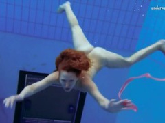 KiloGirls presents: Curly hair redhead swims and looks sexy
