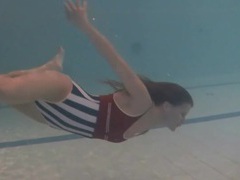 KiloGirls presents: Leggy girl swims and strips naked in pool