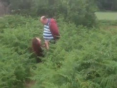 KiloGirls presents: Busty wife jerks off a stranger in a field