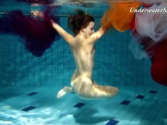 KiloGirls presents: Artful naked underwater show with a hairy pussy girl
