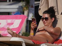 KiloGirls presents: Topless amateur relaxes on a lounge chair