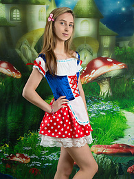 KiloGirls presents: Very hot blonde teen beauty in an adorable outfit slowly takes it off to reveal her nice and perky boobs