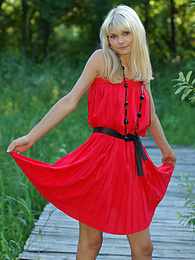KiloGirls presents: Naughty teen appears in her sexy red dress and starts removing it passionately and moving slowly.