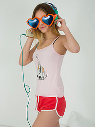 KiloGirls presents: This doll really knows how to have fun with her and how she can show off her pussy and listen to some beats at the same time.